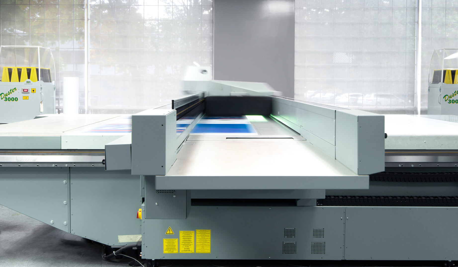 Our UV flatbed printers are the heart of our offering. Utilizing award-winning VariaDot® imaging technology, these devices deliver near-photographic image quality while setting the industry standard for stability and productivity. Thanks to instant-dry UV inks, we can print on a wide range of media for both indoor and outdoor applications including the use of non-white or transparent media with spot white ink applications.