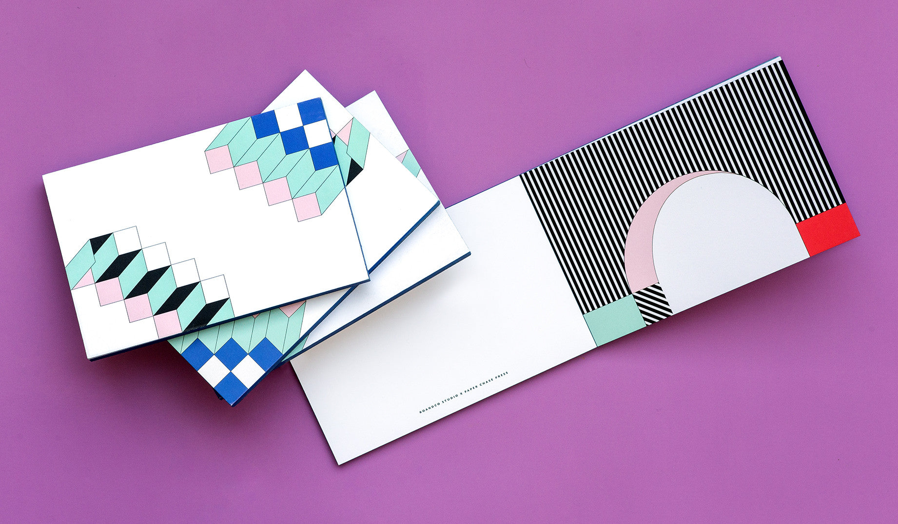 This lively notepad from creative firm RoAndCo features nine distinct Memphis-inspired postcards printed on our classic double thick, bright white uncoated paper, with blue colored edges. <br/><br/>We sat down with Roanne Adams, RoAndCo Chief Creative Director, Founder and self-proclaimed "Art Director, Big Picture Brand Thinker, Boss Lady, Client Therapist, Creative Collaborator, Design Critiquer, Entrepreneur, HR Manager, Public Speaker" for a look into her world.